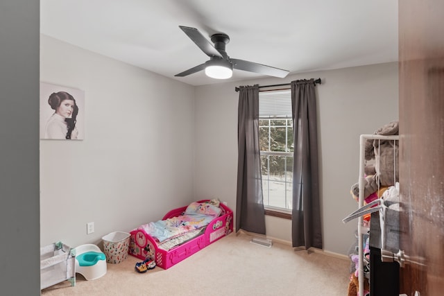 carpeted bedroom with ceiling fan