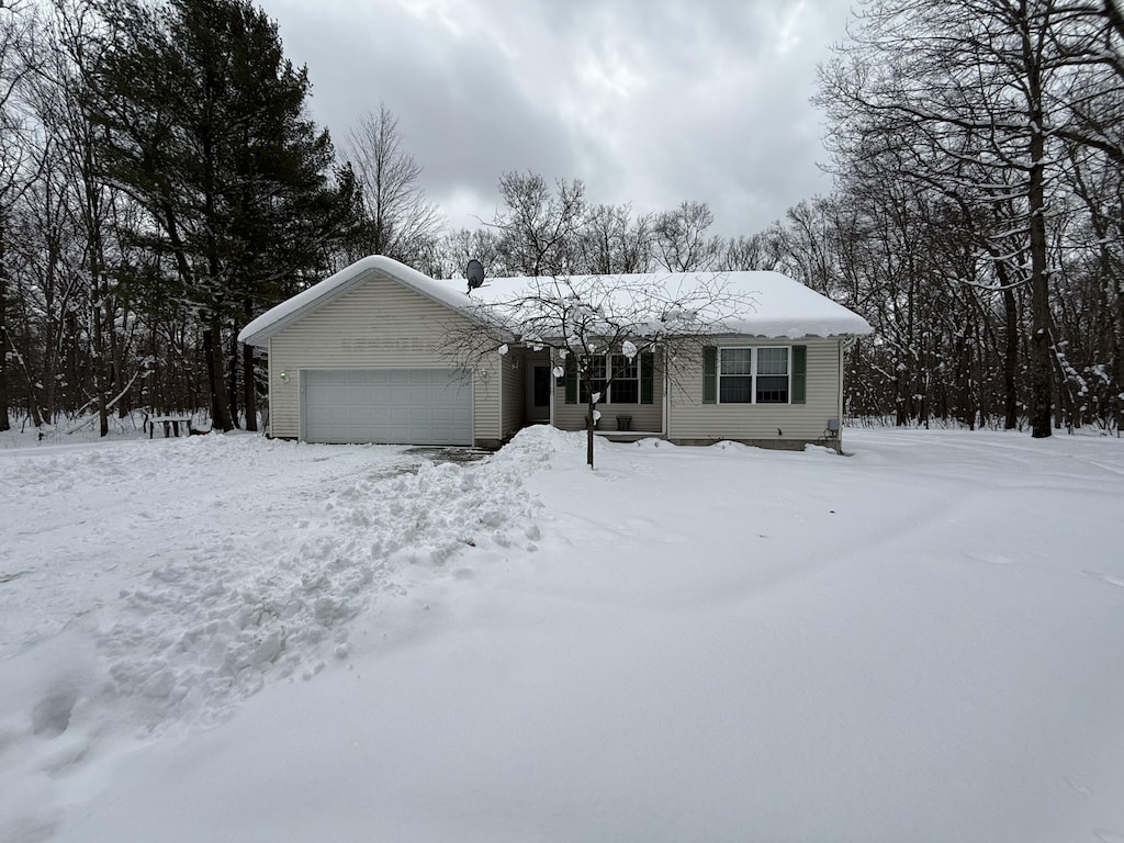 single story home featuring a garage