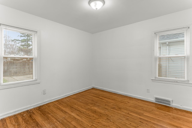 unfurnished room featuring wood-type flooring