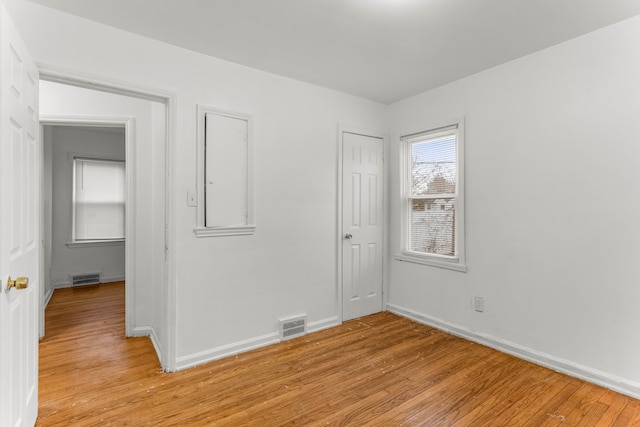 spare room featuring light hardwood / wood-style floors