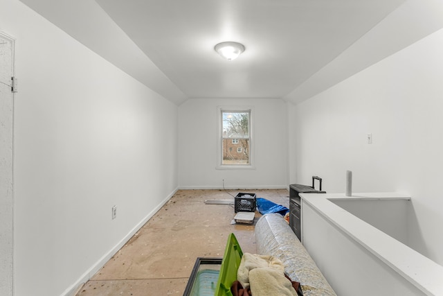 additional living space with vaulted ceiling