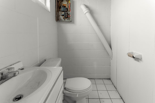 bathroom with vanity, tile patterned floors, and toilet