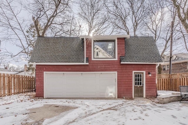 view of snow covered garage