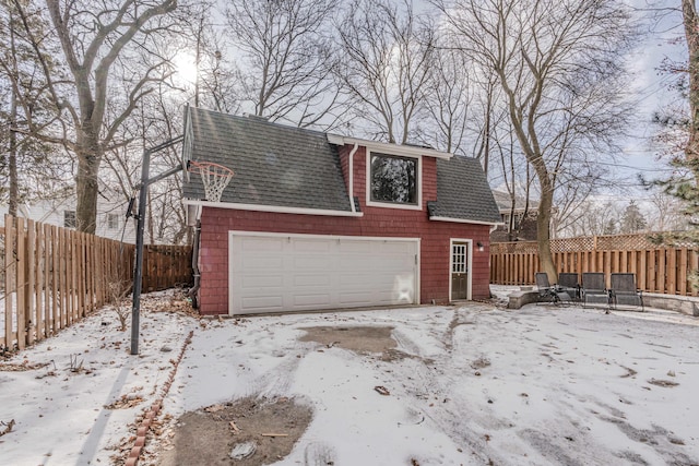 view of snow covered garage