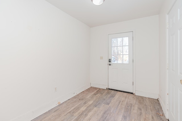 doorway to outside with light hardwood / wood-style flooring