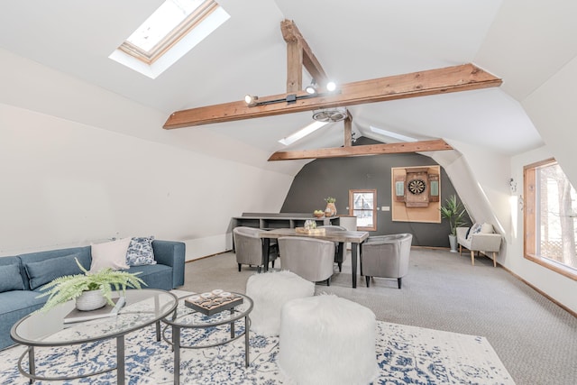 living room with a healthy amount of sunlight and vaulted ceiling with skylight