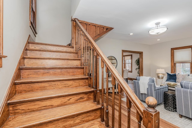 stairs with hardwood / wood-style flooring