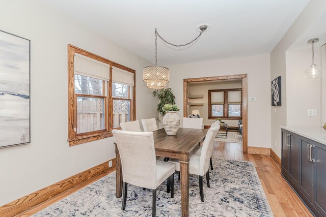 dining space with light wood-type flooring