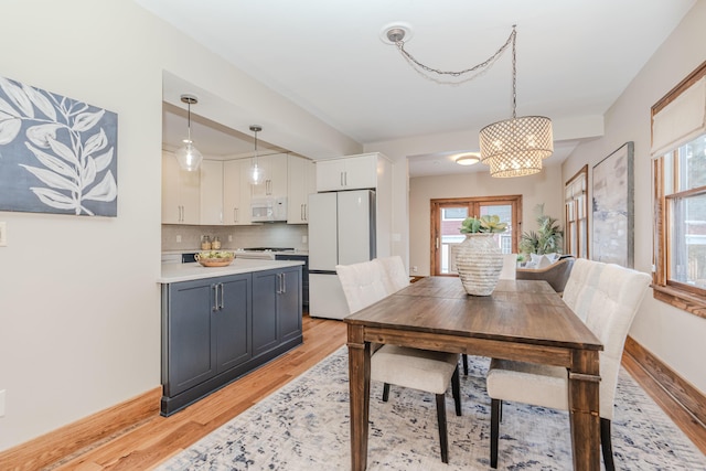 dining space featuring light hardwood / wood-style floors