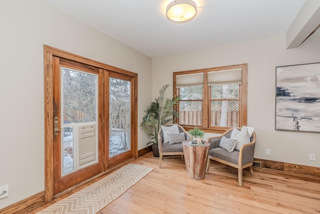 living area with light hardwood / wood-style flooring