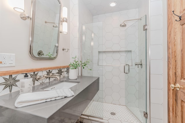 bathroom with vanity and a shower with shower door