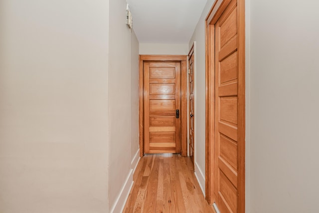 hallway featuring light hardwood / wood-style flooring