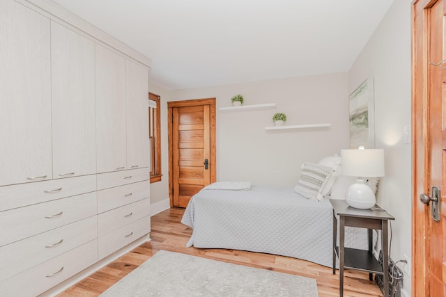 bedroom with light hardwood / wood-style flooring