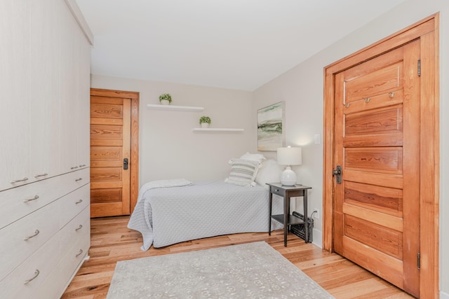 bedroom with light wood-type flooring