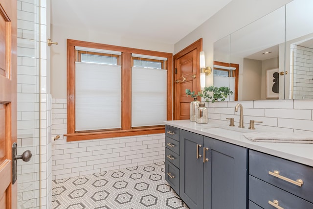 bathroom with tile patterned floors and vanity