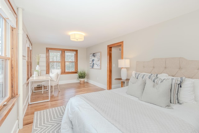 bedroom with light wood-type flooring