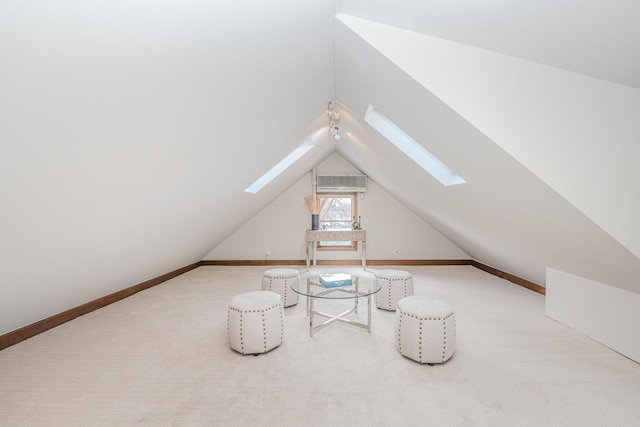 bonus room with lofted ceiling with skylight and carpet floors