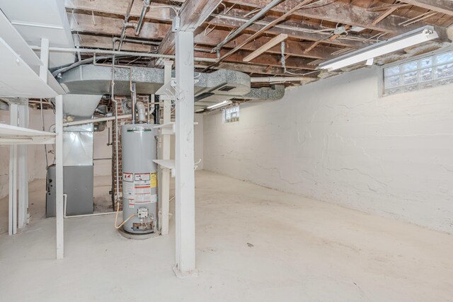 basement with water heater and heating unit