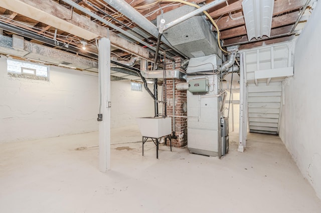 basement with sink and heating unit