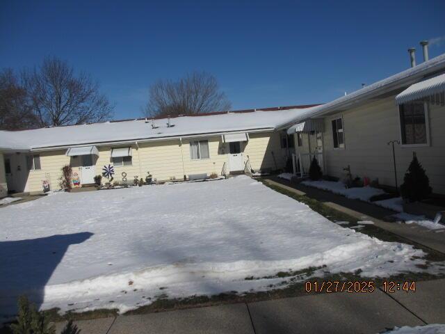 view of snow covered property