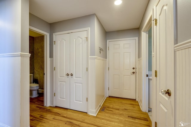 corridor with light wood-type flooring