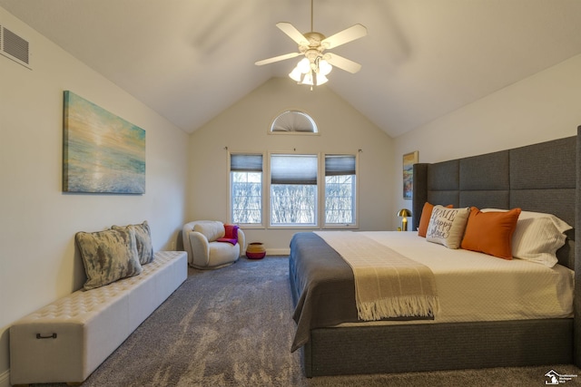 bedroom with lofted ceiling, ceiling fan, and dark colored carpet