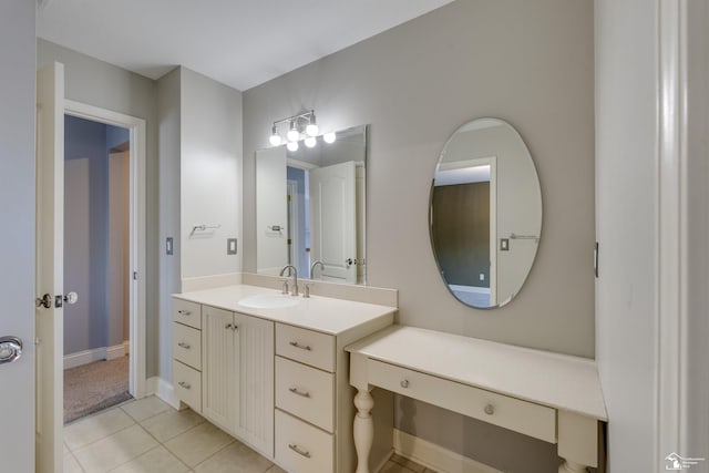 bathroom featuring tile patterned flooring and vanity