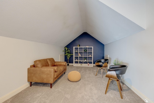 living area with lofted ceiling and carpet floors