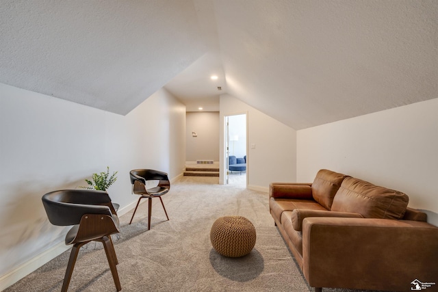 living area with vaulted ceiling and light carpet