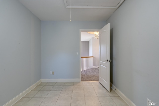 unfurnished room featuring light carpet