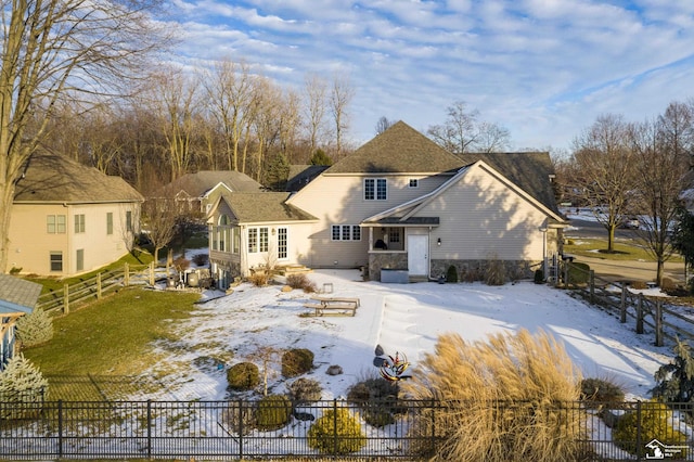 view of snow covered house