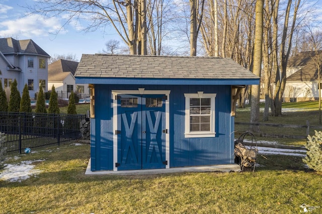 view of outbuilding with a yard