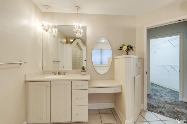 bathroom featuring tile patterned flooring and vanity