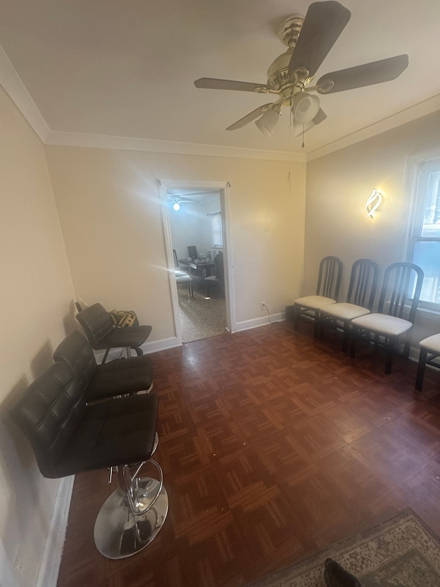 living area featuring ornamental molding and dark parquet floors