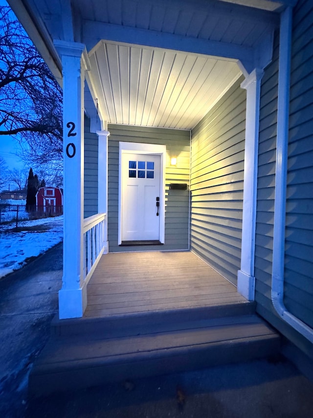 view of snow covered property entrance