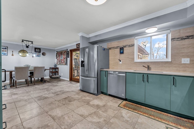 kitchen with sink, backsplash, hanging light fixtures, ornamental molding, and stainless steel appliances