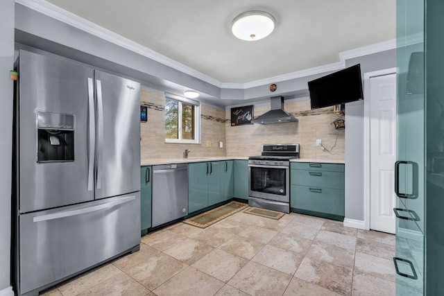 kitchen featuring sink, stainless steel appliances, ornamental molding, decorative backsplash, and wall chimney exhaust hood