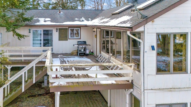 back of house featuring a wooden deck