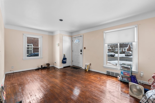 foyer entrance with dark wood-type flooring