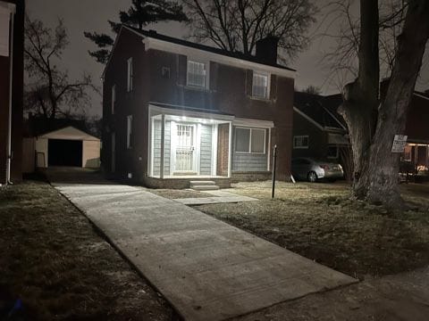 view of front facade with a garage and an outdoor structure