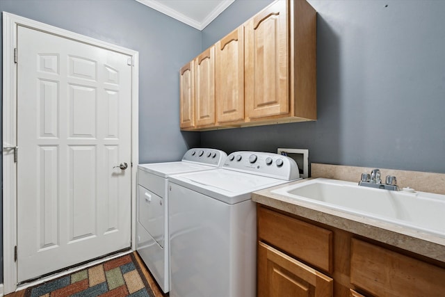 laundry area featuring sink, cabinets, crown molding, and independent washer and dryer