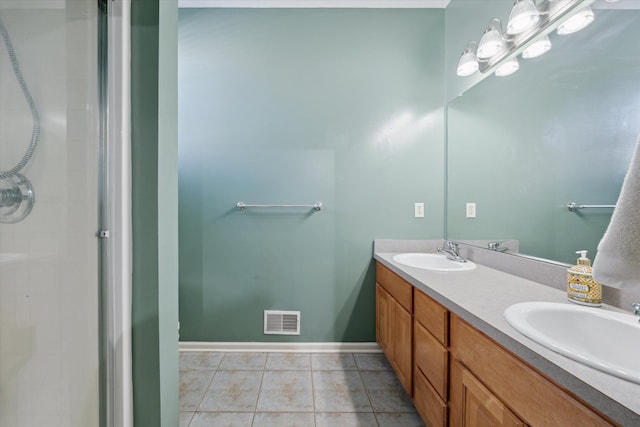 bathroom with vanity and tile patterned flooring