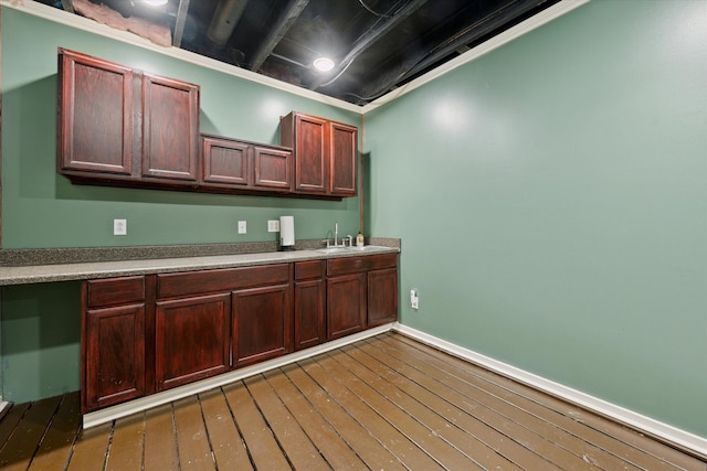 kitchen featuring dark hardwood / wood-style flooring and sink