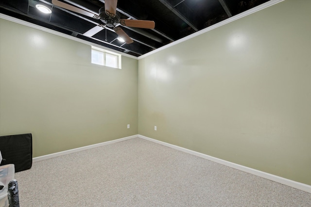 basement featuring carpet floors and ceiling fan