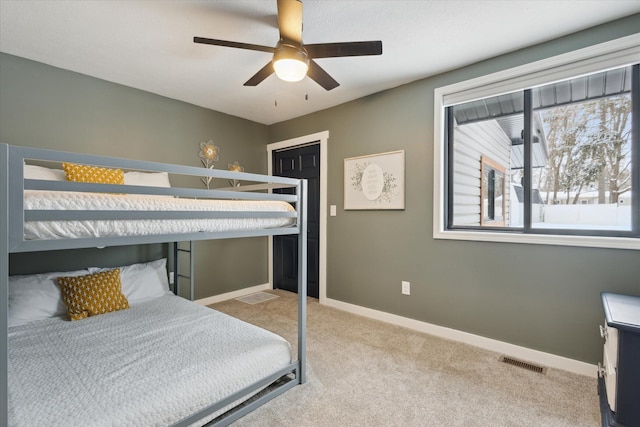 carpeted bedroom with ceiling fan