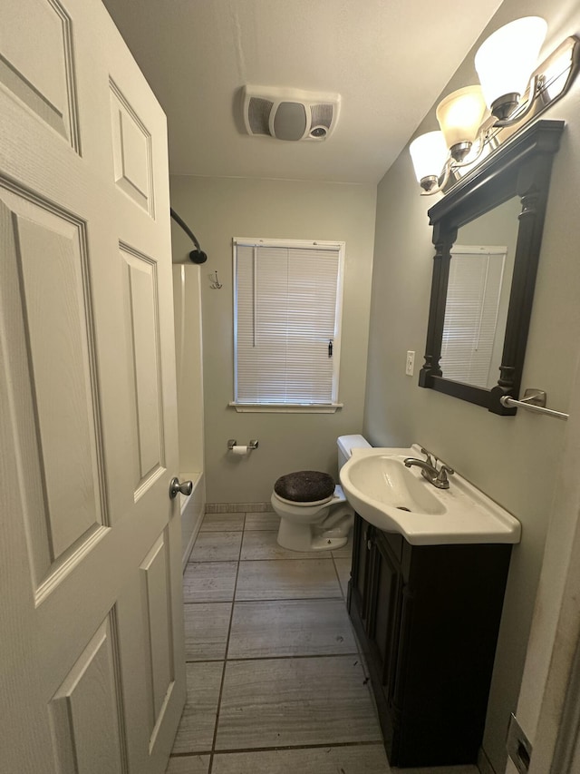 bathroom with visible vents, vanity, toilet, and bathing tub / shower combination