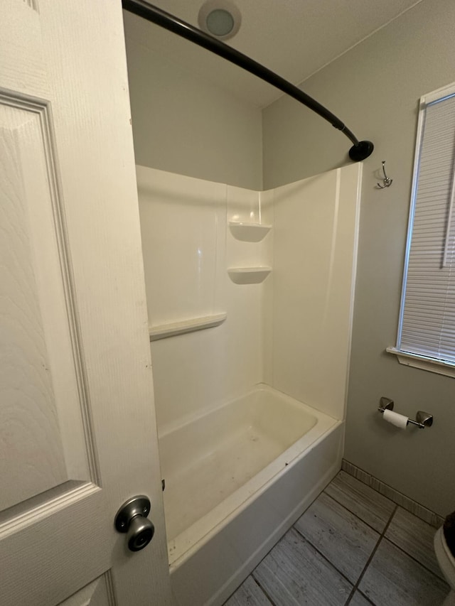 full bathroom featuring baseboards