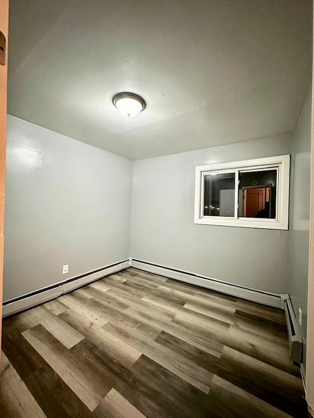 spare room featuring hardwood / wood-style flooring