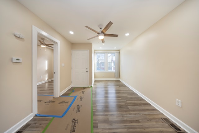 doorway to outside with dark wood-type flooring and ceiling fan