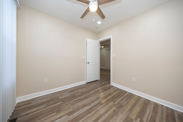 unfurnished room featuring hardwood / wood-style flooring and ceiling fan